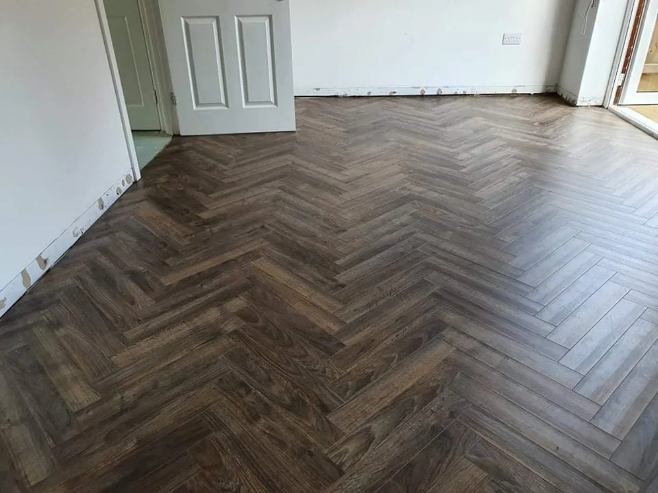 Herringbone wood-effect flooring fitted in a Banbury home