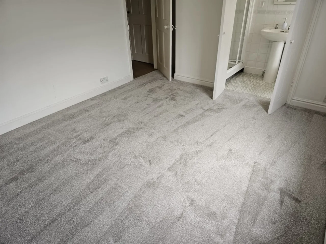 Plush fitted carpet in a living room